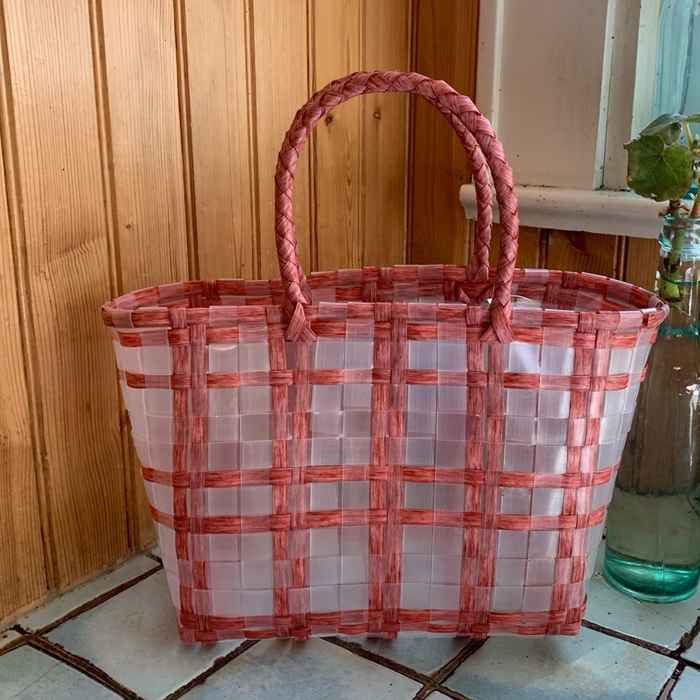 New, unused woven pink and white plaid basket tote